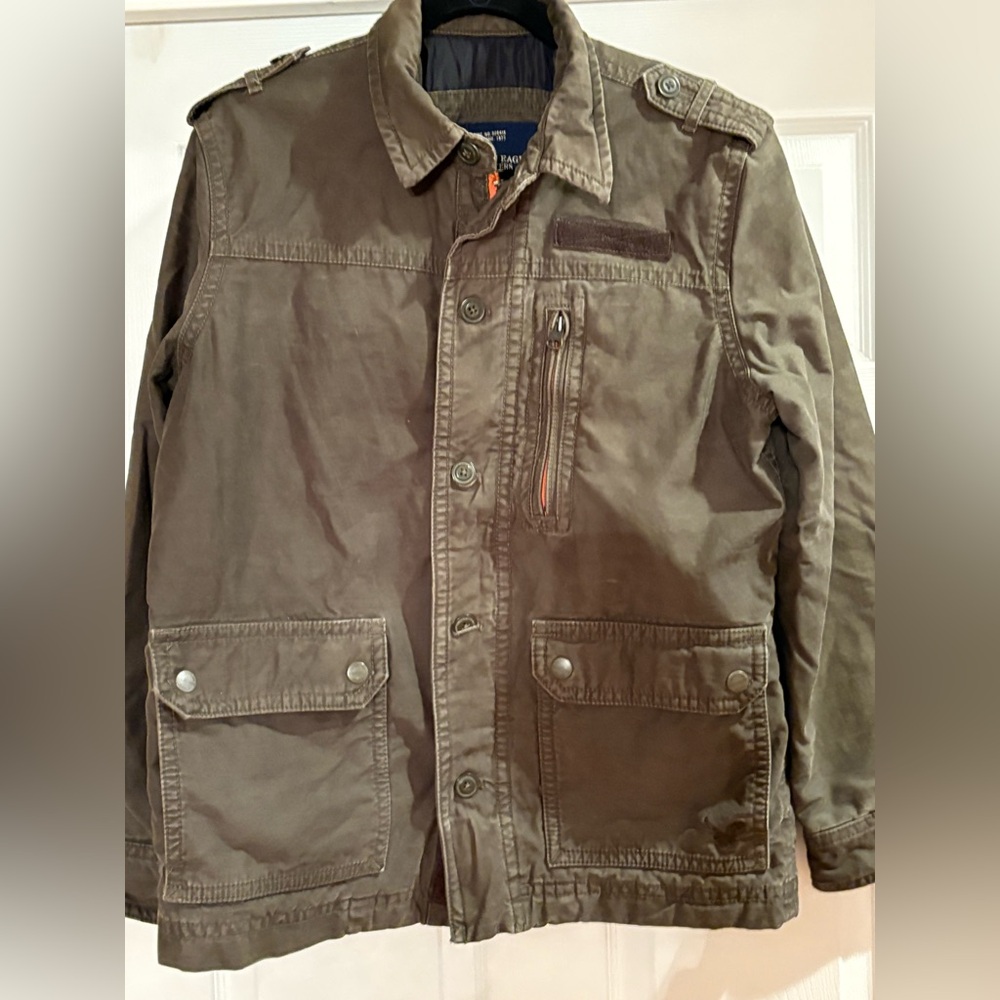 American Eagle olive green coat. Gray shape. Button up and zipper. Warm and soft